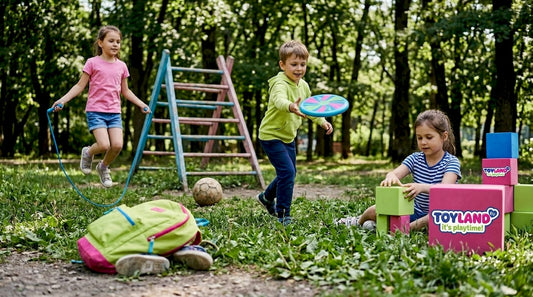 Children playing with outdoor toys in park
