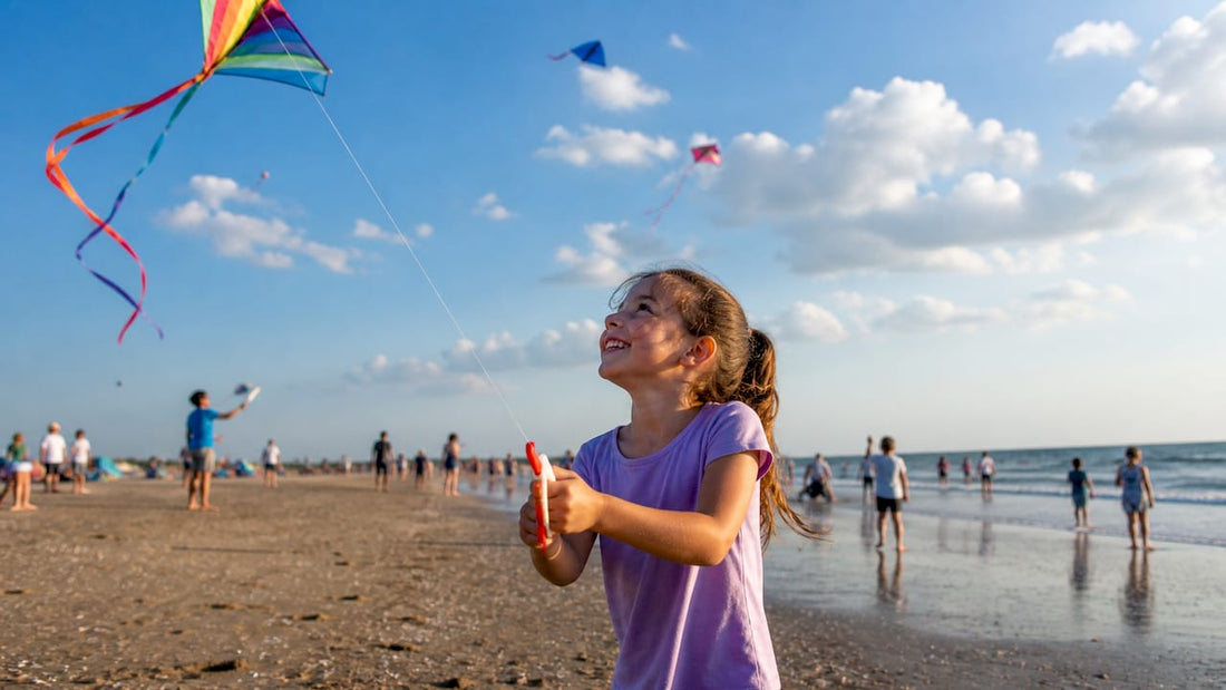 Children and parents flying kites on a beach